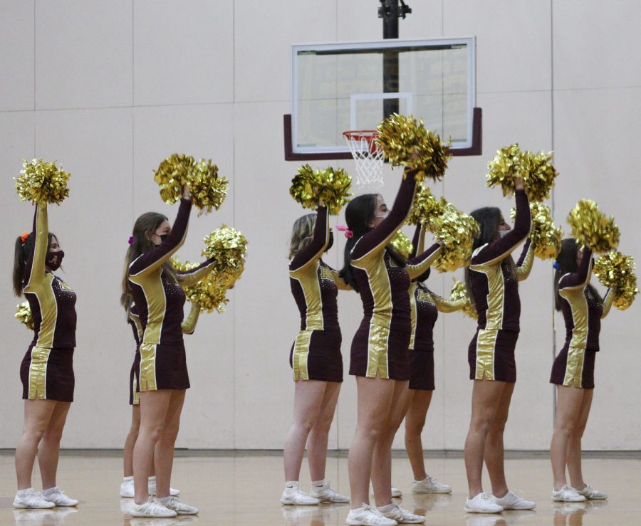 The winter cheerleaders perform during halftime at the game against St. Paul on Dec. 17.