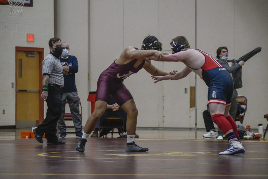 Sophomore Tylor Doherty faces off with opponent in the Wrestling match against North Middlesex Regional on Wednesday, January 13, 2022.