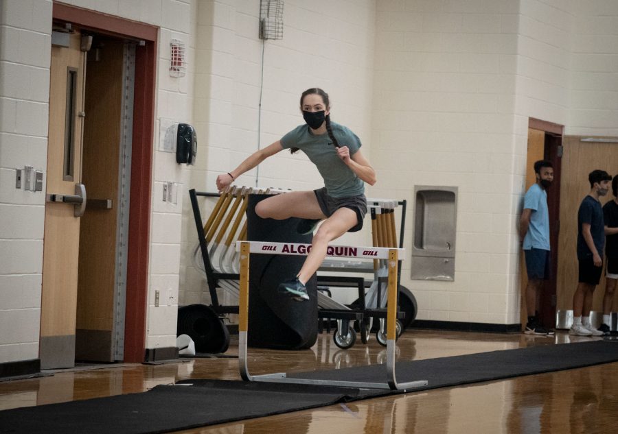 On Feb. 9, Ellie Westphal runs hurdles during indoor track practice.
