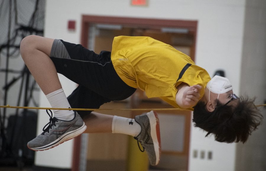 Freshman Nick Scaringi practices high jump at a boys indoor track practice on Feb. 9, 2022. 