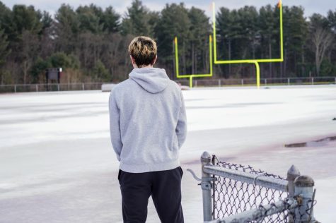 Sophomore Garrett Burns overlooks the football field on Feb. 12, 2022.