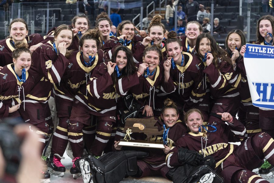 The girls hockey team celebrates their Division 2 State Championship win on March 20th.