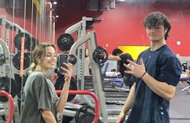 My boyfriend John and I take a break from lifting at my gym on Nov. 30, 2021.