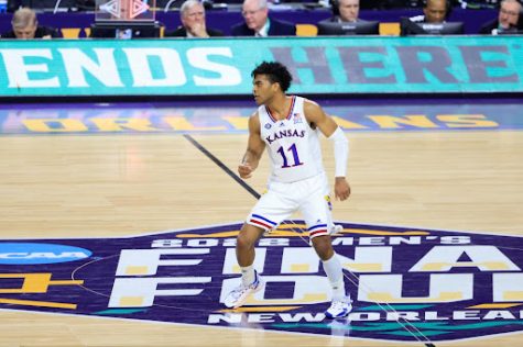 Kansas guard Remy Martin stands near center court in the NCAA Mens Basketball Tournament National Championship Game in New Orleans, Louisiana on April 4, 2022.