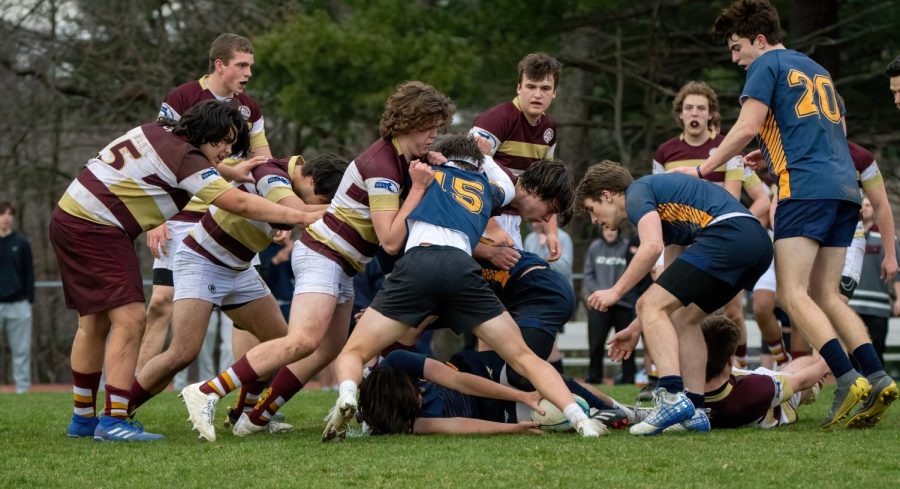 Members of the boys rugby team compete in a game.