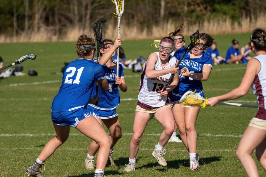 A member of the Algonquin girls lacrosse team competes in a game.