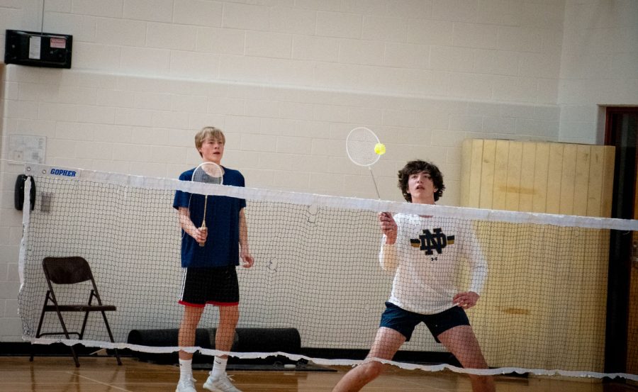 Freshmen Charlie Zilinsky and Brendan Staunton participate in the badminton tournament.