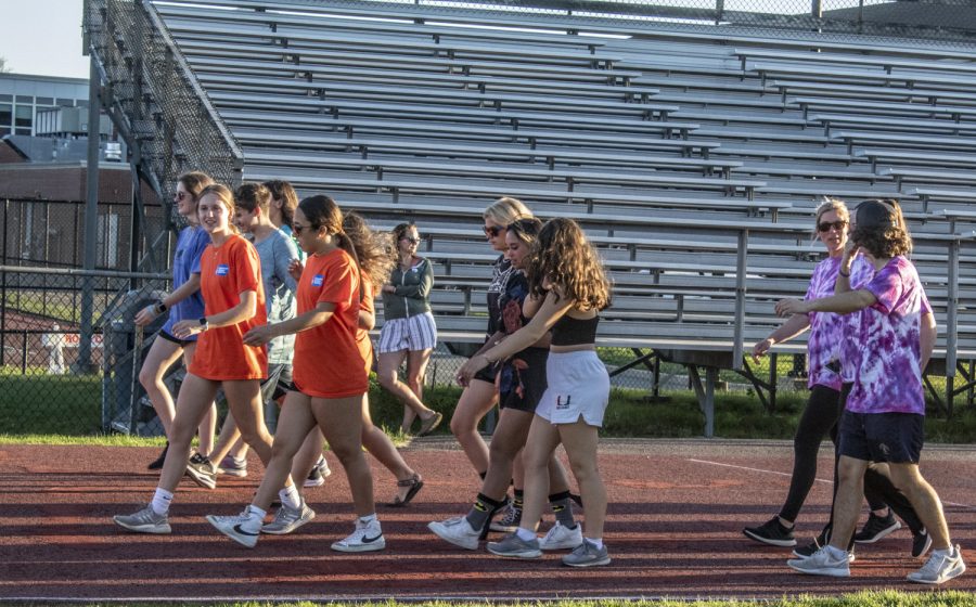 Relay for Life held its first in person relay at Algonquin in 2 years. A group walks around the track for Relay for Life on May 13, 2022.