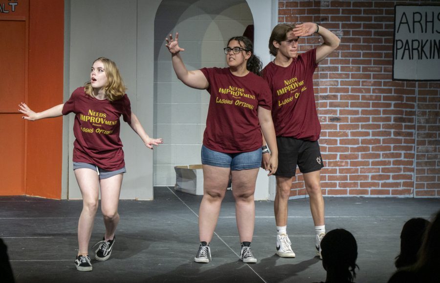 Sophomore Savannah Staples, junior Camilly Fernandes and sophomore Jon Loizeaux perform an improvised skit at the Spring Improv Show in the Black Box Theater.