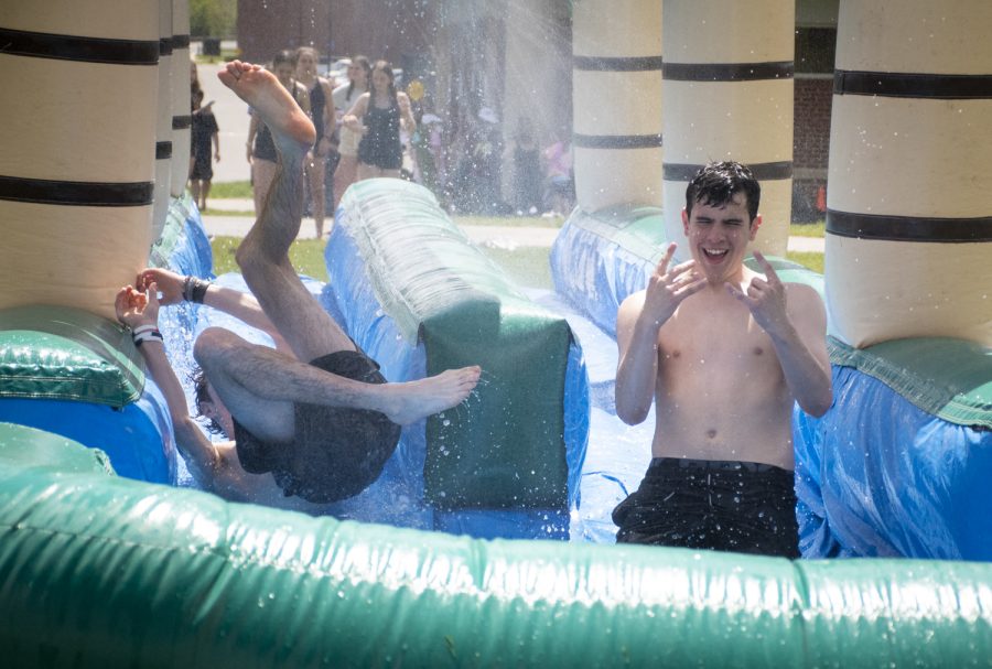 Students slide down the inflatable slip-and-slide during Carnival on May 13, 2022.