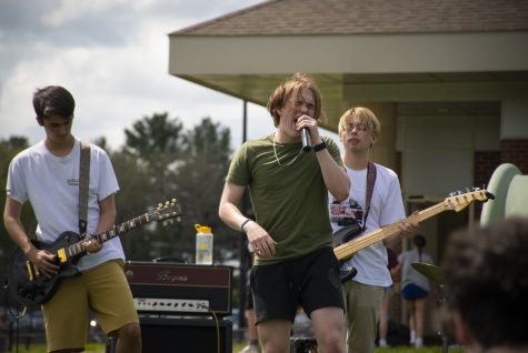 Junior Daniel Boush performs with seniors Thomas Davis and Connor Veitch at Carnival on May 13, 2022.