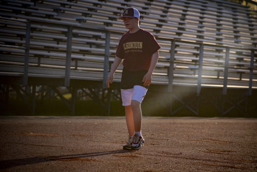 Freshman Liam Fitzgerald, a cancer survivor, walks the track during Relay for Life, held on Friday, May 13, 2022. 