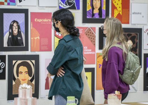 Visitors admire the artwork created by Algonquin students at the Spring Art Show on Tuesday, May 24.