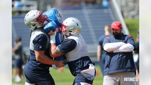 Two rookie offensive linemen, first round pick Cole Strange and undrafted free agent Kody Russey, face off in practice.