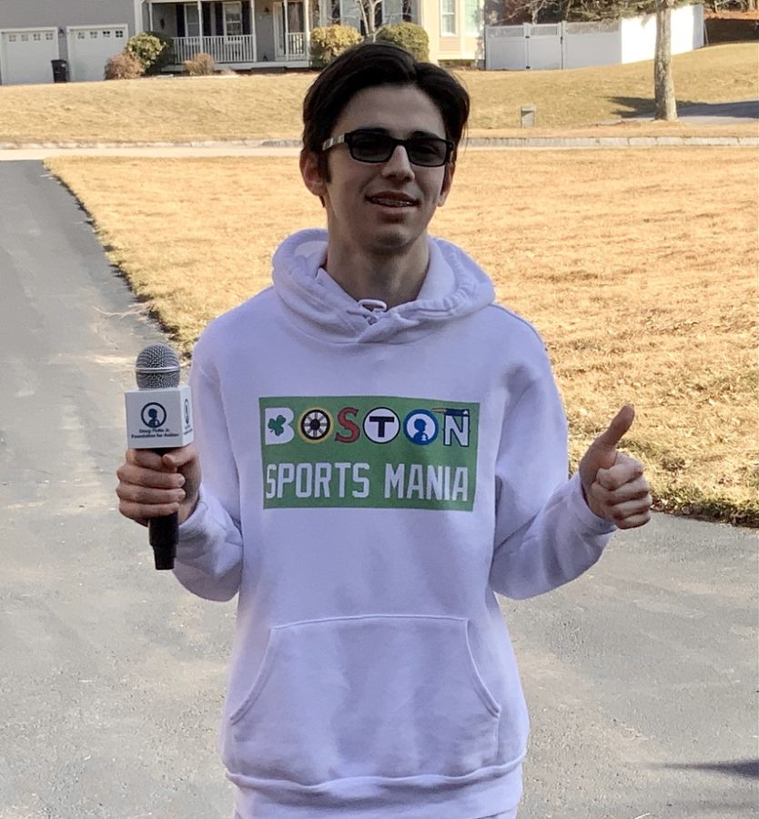 Me wearing a hoodie I designed with my new sports blog logo.