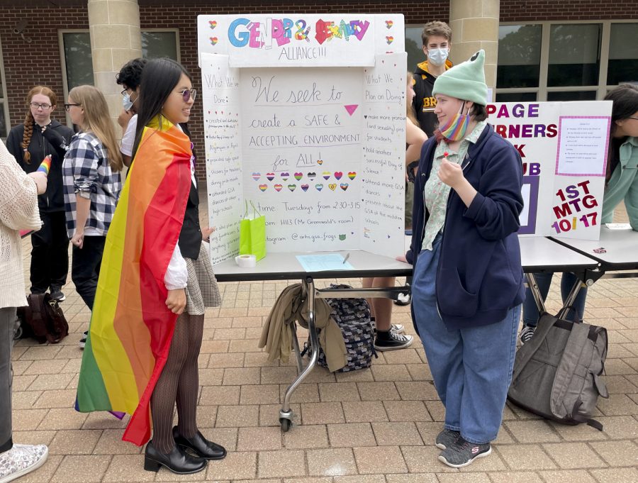 Junior Sage Lai(Left) and senior Thyme Portner promote the Gender and Sexuality Club, a club dedicated to creating a safe environment for all students, during the Activities Extravaganza held during all three lunches on Wednesday, Sept. 21, 2022.