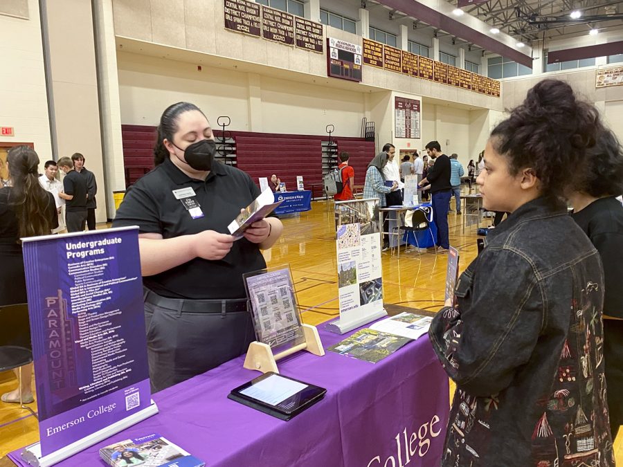 A representative from Emerson College talks to a student. Over 80 schools participated in Algonquins College Fair on Oct. 6.