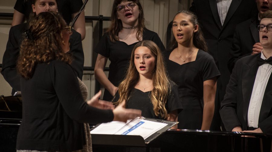 On+October+25%2C+Algonquin+students+performed+at+the+Fall+Choral+Concert.+The+majority+of+choruses+were+conducted+by+chorus+teacher+Olivia+Goliger.