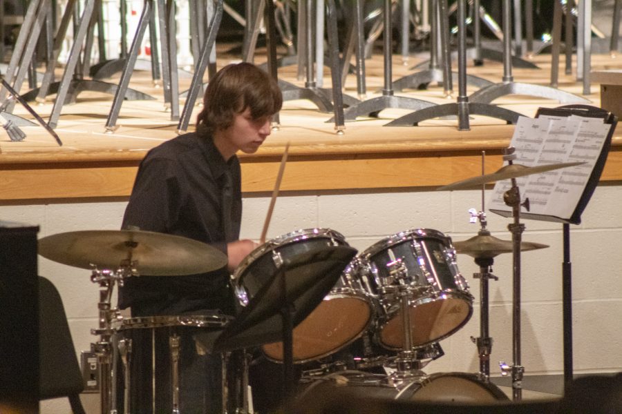 Sophomore Henry Hart performs on the drums at the Fall Instrumental Concert on Nov. 2, 2022.