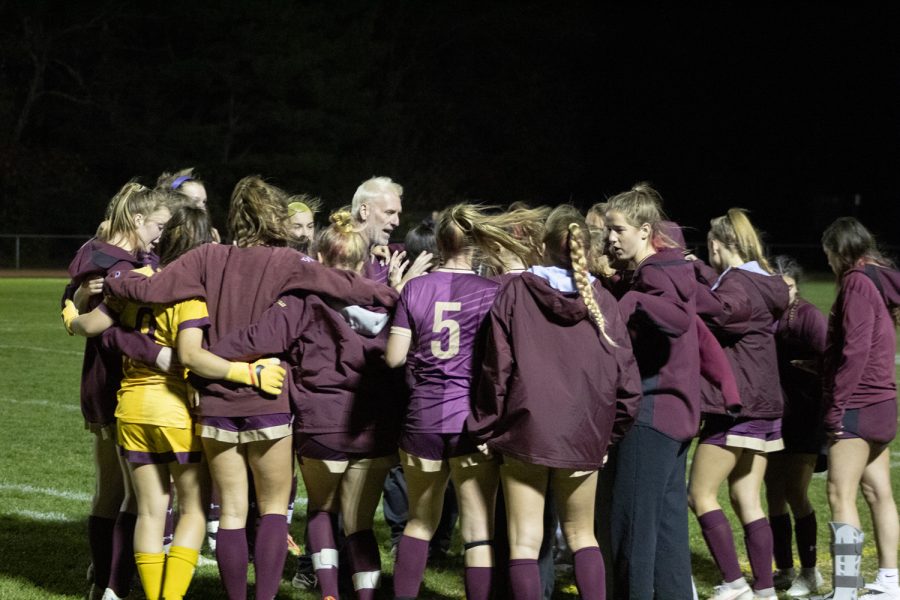 Girls+soccer+coach+John+Frederick+gives+a+speech+to+the+team+inside+a+pre-game+huddle+before+the+state+tournament+game+against+Durfee+on+Nov.+7%2C+2022.+The+Titans+won+10-1.