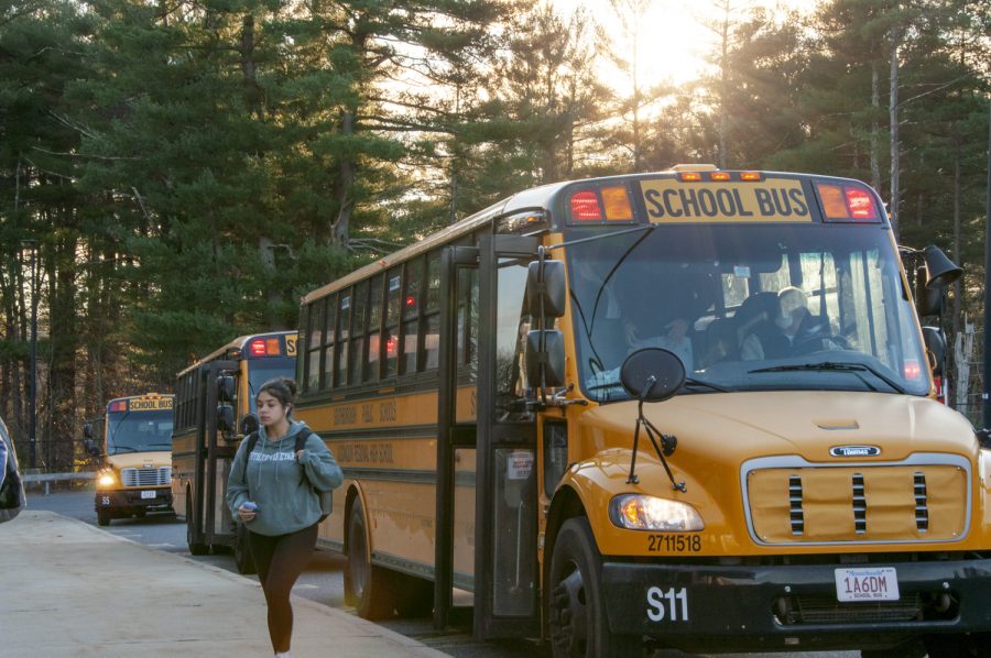 Students get off their bus in the morning. Busses are in shortage, which has been a problem for a while.