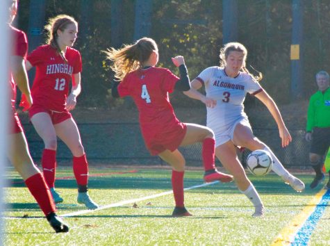 Senior Sadie Candela dribbles the ball around a defender at the Division 1 Championship on Nov. 19, 2022.