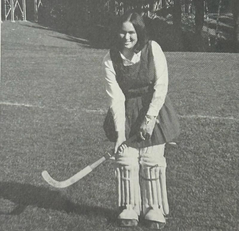 Patti Fouracre Serafin holds a field hockey stick, 1971.