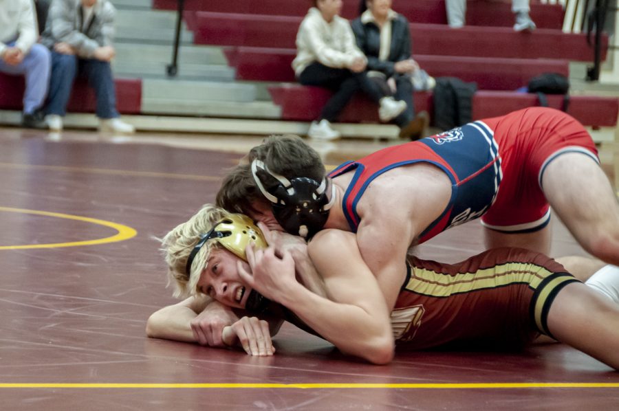 Sophmore Garrett Willwerth takes on his opponent from Tyngsboro during the wrestling meet on Dec. 14 at Algonquin. The Titans lost to the Tigers, 27-43.
