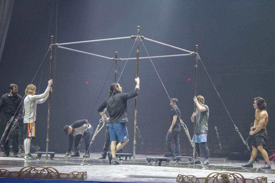 Performers of the “Tournik” act take down the bars after their warmup for the opening night of Cirque du Soleil in Worcester.