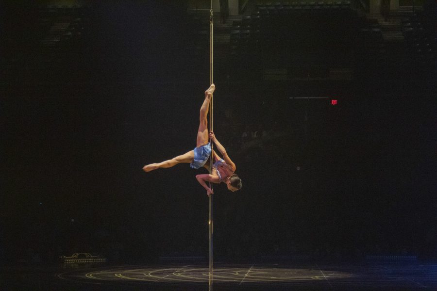 An artist performs on a levitating pole in Cirque du Soleils show, Corteo, on Jan. 12, 2023.