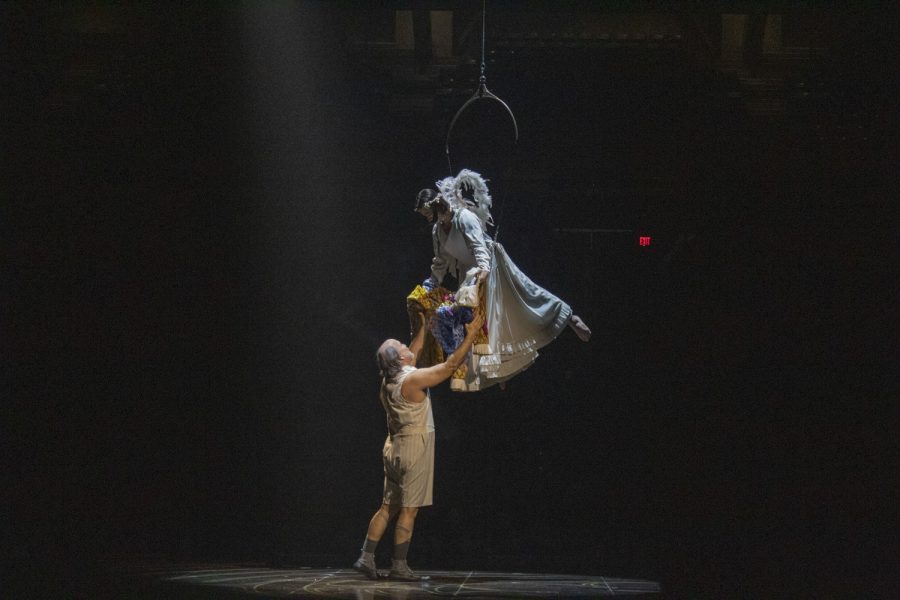 A performer gets his clown costume from an angel up above during the show Corteo by Cirque du Soleil on Jan. 12, 2023.