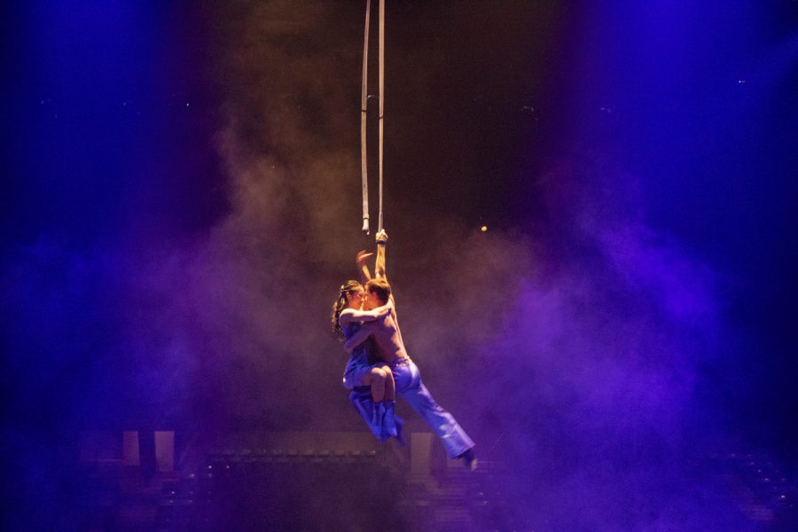 In Cirque du Soleils “Corteo,” two arial contortionists hold each other up in the air while wrapped in a silk rope at the Worcester DCU Center.