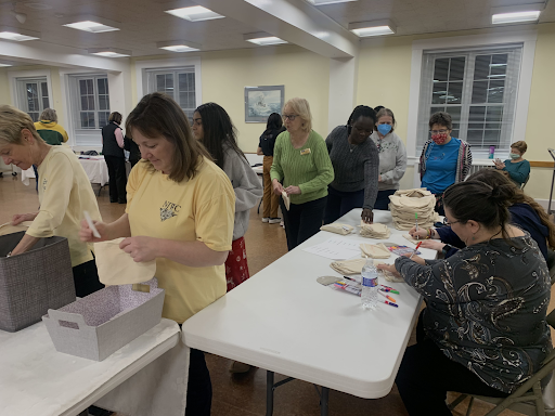 Volunteers at the Period Palooza decorate canvas pouches while others fill them with sanitary products. The kits will be sent to the districts’ public schools, the Northborough Food Pantry and the Northborough Library.