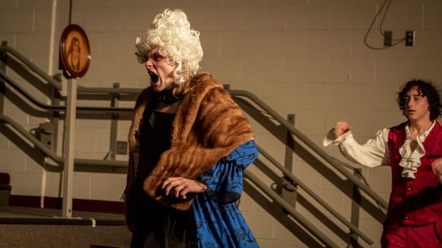 Performing as Madam Pernelle, senior Alex Reineke yells during a rehearsal for the upcoming play "Tartuffe." Opening night is Thursday, March 9.