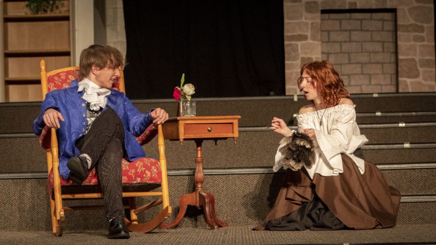 During a rehearsal for the upcoming play, Tartuffe, seniors Nathan Spadafora and Jay Guarino speak to each other. The plays opening night is Thursday, March 9.