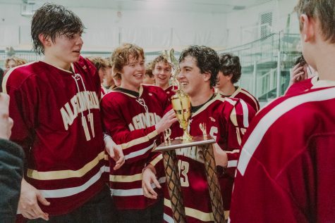 The boys hockey team celebrates their 5-3 victory over Marlborough in the MetroWest Daily News Cup on Dec. 28, 2022.