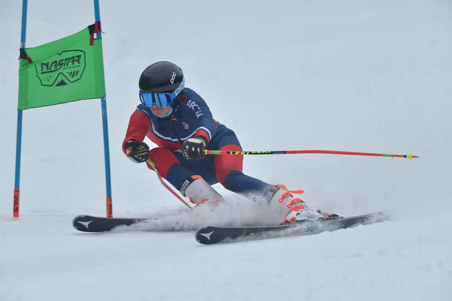Senior Michael Desio skis down the slope at Wachusett Mountain.