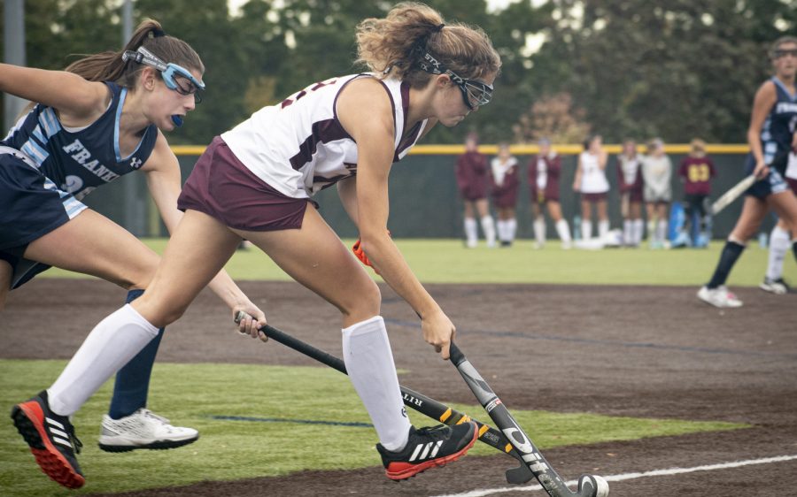 Lindsey Brown fights for the ball at field hockey Senior Night on Oct. 18, 2021.