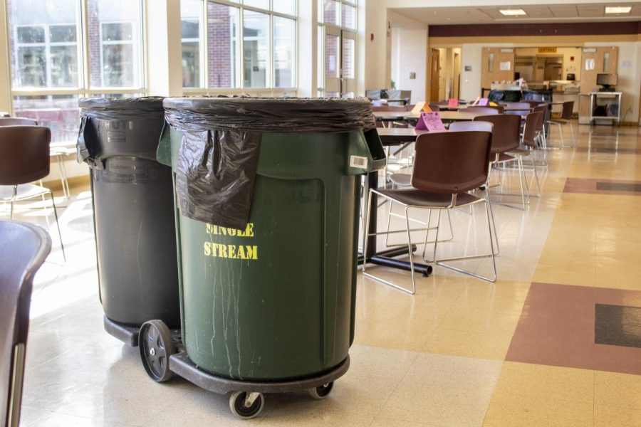 Before students enter the cafeteria for their lunch, many pairs of recycling and trash cans are spread throughout the area.