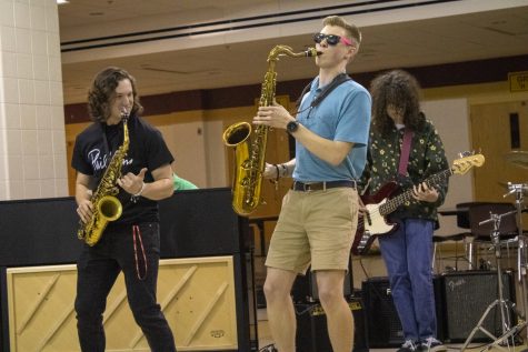 Seniors Andrew Schuler (Alto saxophone), Noah LaBelle (Tenor saxophone) and sophomore David Allexenberg (Bass) perform the song Chameleon by Herbie Hancock at the Tri-M Coffeehouse.