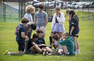 Seniors look through the yearbook as Carnival comes to a close on May 19, 2023.