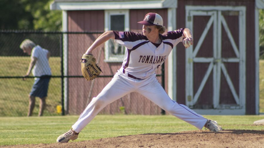 Junior Jackson Redfern steps to pitch the ball during the baseball game on June 1. Algonquin beat Acton-Boxboro 5-1 to move on to the Round of 32.