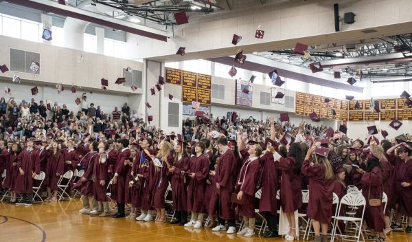 The Class of 2023 toss their caps into the air as the Graduation concludes on June 4.