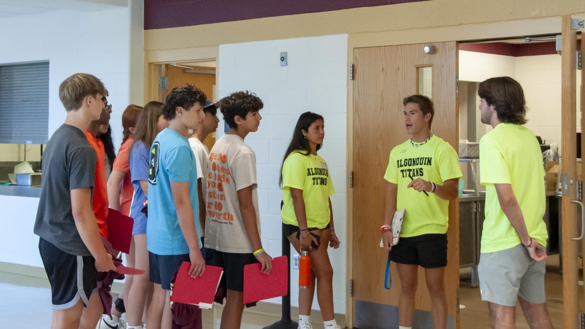Peer mentors connect with the freshmen as they walk around the building. Tours during the Freshman Orientation include the library, the cafeteria, the halls and more. 