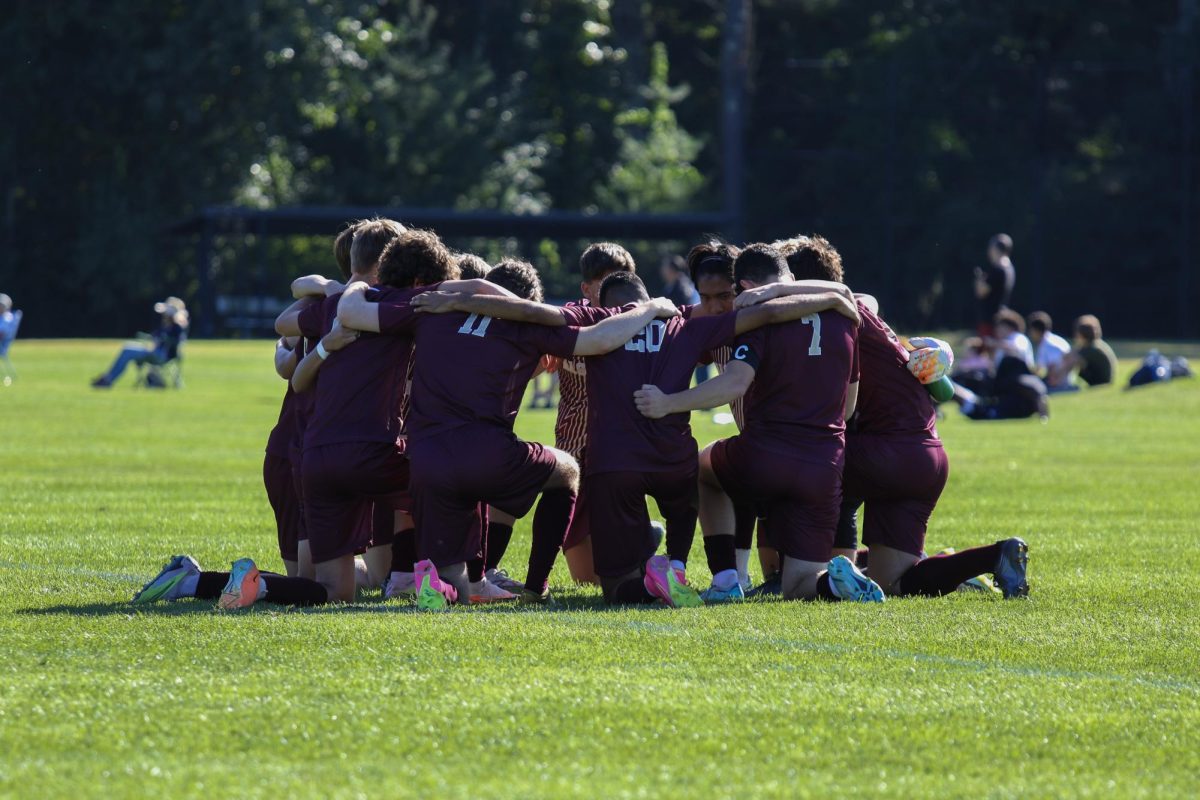 The boys varsity soccer team huddles up; the team won 1-0 against Leominster on Sept. 14.