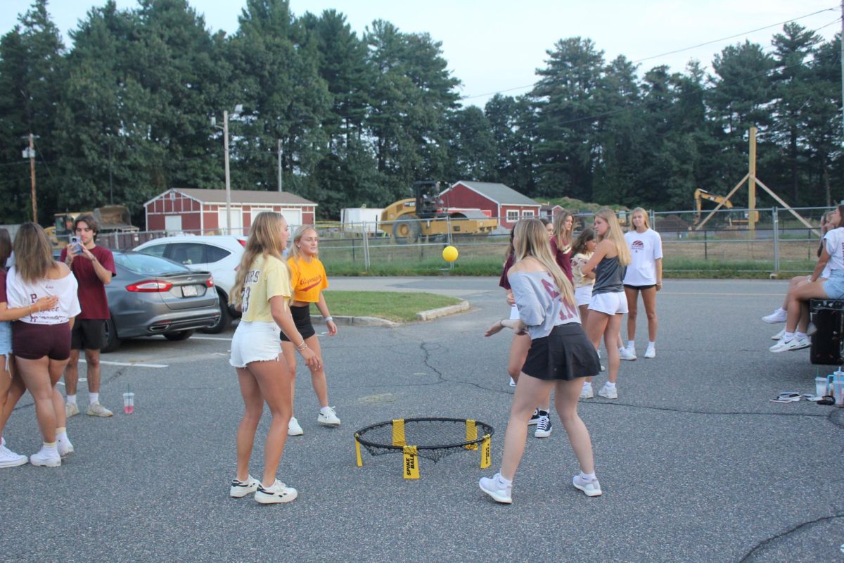 Seniors play Spikeball in the parking lot before school on Sept. 8.