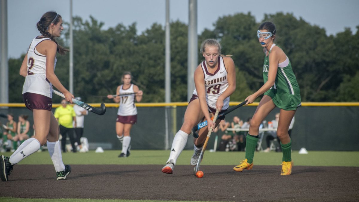 Freshman Courtney Shifrin dribbles the ball past an opponent during the field hockey game on Sept. 22; Algonquin beat Sutton 4-0.