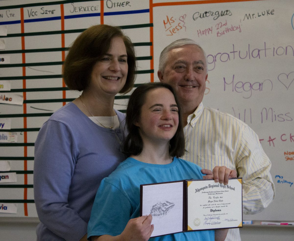 Chute and her parents pose for a photo after Chute was awarded her diploma at the CAP Graduation on Oct. 20, 2023.