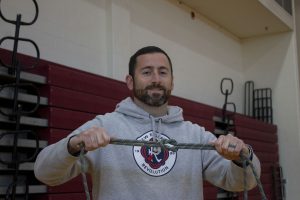 Chris Kirwan, Algonquins newest gym teacher, displays his knot tying skills.