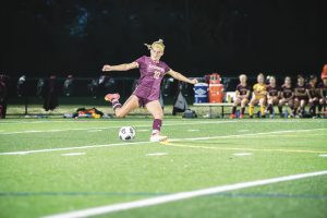 Senior captain Kylie Tomasetti kicks the ball at the girls soccer game against Wachusett on Oct. 25; Algonquin won 4-1.